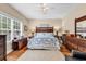 Bedroom featuring a king-size bed, ceiling fan, and plenty of natural light at 1005 Kelly Ct., Garden City Beach, SC 29576