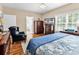 Comfortable bedroom with stylish furniture, hard flooring and a view to bathroom at 1005 Kelly Ct., Garden City Beach, SC 29576