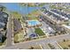 Community aerial shot showing pool, clubhouse, tennis court, bocce court, parking, and well-kept landscaping at 1031 Cascade Loop, Little River, SC 29566