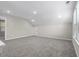 Spacious bonus room with natural light and neutral carpeting at 1031 Cascade Loop, Little River, SC 29566