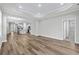 Spacious living area with an open floor plan, featuring wood floors and recessed lighting throughout at 1031 Cascade Loop, Little River, SC 29566