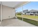 Screened porch area, offering views of the fenced backyard and neighborhood at 1031 Cascade Loop, Little River, SC 29566