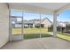 View from screened-in porch of well-maintained backyard and neighboring homes at 1031 Cascade Loop, Little River, SC 29566