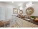 Elegant bathroom features a double vanity, decorative mirrors, and natural light from plantation shutters at 109 Pioneer Loop, Georgetown, SC 29440