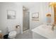 Well lit bathroom featuring a modern vanity, framed artwork, and a glass-enclosed shower at 109 Pioneer Loop, Georgetown, SC 29440