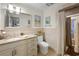 Bathroom featuring a white vanity with granite countertops, neutral tile, and walk-in shower with glass doors at 109 Pioneer Loop, Georgetown, SC 29440