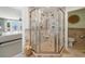 Tiled shower enclosure featuring both a handheld and rainfall shower head with ocean views from the Primary bedroom at 109 Pioneer Loop, Georgetown, SC 29440