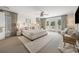 Bright bedroom featuring a large bed, neutral tones, and access to an outdoor balcony with natural light at 109 Pioneer Loop, Georgetown, SC 29440