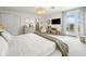 Bright bedroom showcasing ocean views, crisp white walls and linens, with a charming decor at 109 Pioneer Loop, Georgetown, SC 29440
