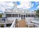 Multi-level deck featuring seating, a grilling area, and serene outdoor space at 109 Pioneer Loop, Georgetown, SC 29440