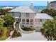 Stunning beachside home with a metal roof, manicured landscape, and gorgeous ocean views at 109 Pioneer Loop, Georgetown, SC 29440