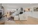 Open-concept living room with modern furniture, day bed, stylish rug, and natural light at 109 Pioneer Loop, Georgetown, SC 29440