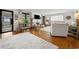 Bright and airy living room with hardwood floors, stylish decor, fireplace, and large windows at 109 Pioneer Loop, Georgetown, SC 29440