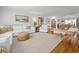 Bright, cozy living room features hardwood floors, white furniture, and stylish decor at 109 Pioneer Loop, Georgetown, SC 29440