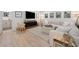 Inviting living room with a large sectional sofa, decorative artwork, and a cozy ambiance, perfect for relaxation at 109 Pioneer Loop, Georgetown, SC 29440