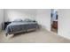 Bedroom with neutral carpeting, fresh white walls, and a bathroom en suite at 109 Winding Path Dr., Loris, SC 29569