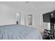 Bedroom with neutral carpeting, fresh white walls, an en suite, and an open doorway at 109 Winding Path Dr., Loris, SC 29569