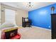 Bedroom with blue accent wall plus carpeted floor and a modern desk setup at 109 Winding Path Dr., Loris, SC 29569