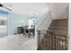 Bright dining area features a table with six chairs and stairway with safety gate at 109 Winding Path Dr., Loris, SC 29569