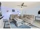 Comfortable living room with recliner seating, ceiling fan, and stylish decor at 109 Winding Path Dr., Loris, SC 29569