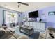 Living room with recliner seating, mounted TV, ceiling fan and accent decor at 109 Winding Path Dr., Loris, SC 29569