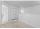 Loft area featuring neutral carpeting, fresh white walls, and natural light streaming through the windows at 109 Winding Path Dr., Loris, SC 29569