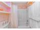 Bathroom featuring shower and tub combo, storage, and bright lighting at 1100 Possum Trot Rd. # H136, North Myrtle Beach, SC 29582