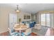 Comfortable living room and dining area, complete with a sliding glass door to the balcony at 1100 Possum Trot Rd. # H136, North Myrtle Beach, SC 29582
