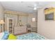 Charming bedroom with a ceiling fan, large dresser, and decorative accents for relaxing retreat at 1100 Possum Trot Rd. # H136, North Myrtle Beach, SC 29582