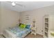 Comfortable main bedroom offering a calming retreat with a queen bed, lamps, and dresser at 1100 Possum Trot Rd. # H136, North Myrtle Beach, SC 29582