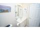 Neat bathroom featuring white vanity with a large mirror and decorative artwork at 1101 Peace Pipe Pl. # 201, Myrtle Beach, SC 29579