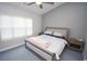 Bedroom featuring neutral tones, plush carpeting, and large window for natural light at 1101 Peace Pipe Pl. # 201, Myrtle Beach, SC 29579