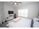 Bedroom with a ceiling fan, a TV mounted on the wall, and neutral walls and carpet at 1101 Peace Pipe Pl. # 201, Myrtle Beach, SC 29579