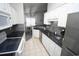 Well-appointed kitchen with white cabinetry, dark countertops, stainless steel appliances, and tile backsplash at 1101 Peace Pipe Pl. # 201, Myrtle Beach, SC 29579