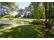 Peaceful pond reflecting the blue sky, surrounded by vibrant green grass at 1101 Peace Pipe Pl. # 201, Myrtle Beach, SC 29579