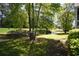 Lush greenery surrounds a scenic pond view near the building at 1101 Peace Pipe Pl. # 201, Myrtle Beach, SC 29579