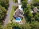Aerial view of a private residence with a large pool, patio, and manicured backyard at 12 Gloucester Pl., Pawleys Island, SC 29585