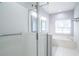 Modern bathroom featuring a glass-enclosed shower, separate tub, and bright lighting at 12 Gloucester Pl., Pawleys Island, SC 29585