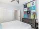 Cozy bedroom with dresser, closet, and beach-themed wall decor at 12 Gloucester Pl., Pawleys Island, SC 29585