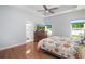 Spacious bedroom with wood flooring, a TV, and view to the backyard at 12 Gloucester Pl., Pawleys Island, SC 29585