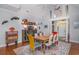Bright dining room featuring high ceilings, hardwood floors, and colorful decor at 12 Gloucester Pl., Pawleys Island, SC 29585