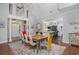 Bright dining room featuring high ceilings, hardwood floors, and colorful decor at 12 Gloucester Pl., Pawleys Island, SC 29585