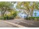 Welcoming gated entrance to the property with mature trees and lush greenery at 12 Gloucester Pl., Pawleys Island, SC 29585