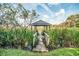 Charming gazebo with a small bridge overlooking marshland and open spaces at 12 Gloucester Pl., Pawleys Island, SC 29585