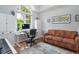 Cozy home office with large window, desk, and comfortable seating area at 12 Gloucester Pl., Pawleys Island, SC 29585