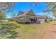 A well-maintained backyard with green grass and surrounding vegetation, offering privacy at 139 Chenoa Dr. # D, Murrells Inlet, SC 29576