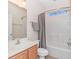 Well-lit bathroom with vanity, mirror, and modern shower at 139 Chenoa Dr. # D, Murrells Inlet, SC 29576