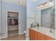 Well-lit bathroom with a double sink vanity and a closet at 139 Chenoa Dr. # D, Murrells Inlet, SC 29576