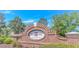 Attractive community entrance with brick sign and lush landscaping at 139 Chenoa Dr. # D, Murrells Inlet, SC 29576