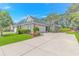 Charming single story home with a manicured lawn and a long driveway on a sunny day at 139 Chenoa Dr. # D, Murrells Inlet, SC 29576